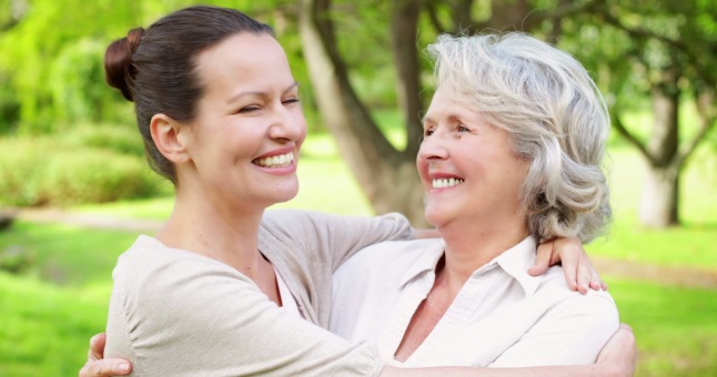 stock-footage-mother-and-adult-daughter-hugging-and-smiling-at-camera-in-the-park-on-a-sunny-day